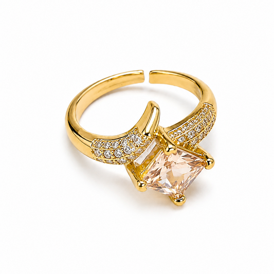 Zircon ring with a large pink gemstone on a white background