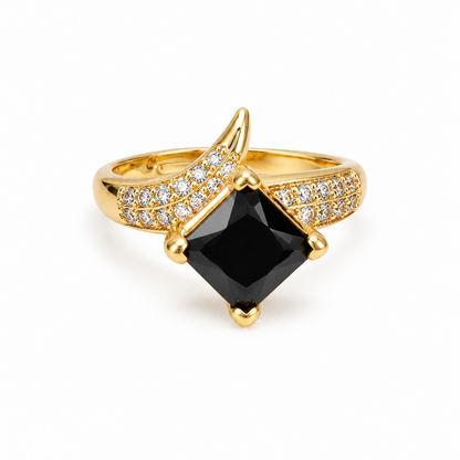 ZIRCON ring with a black gemstone andZircon accents on a white background